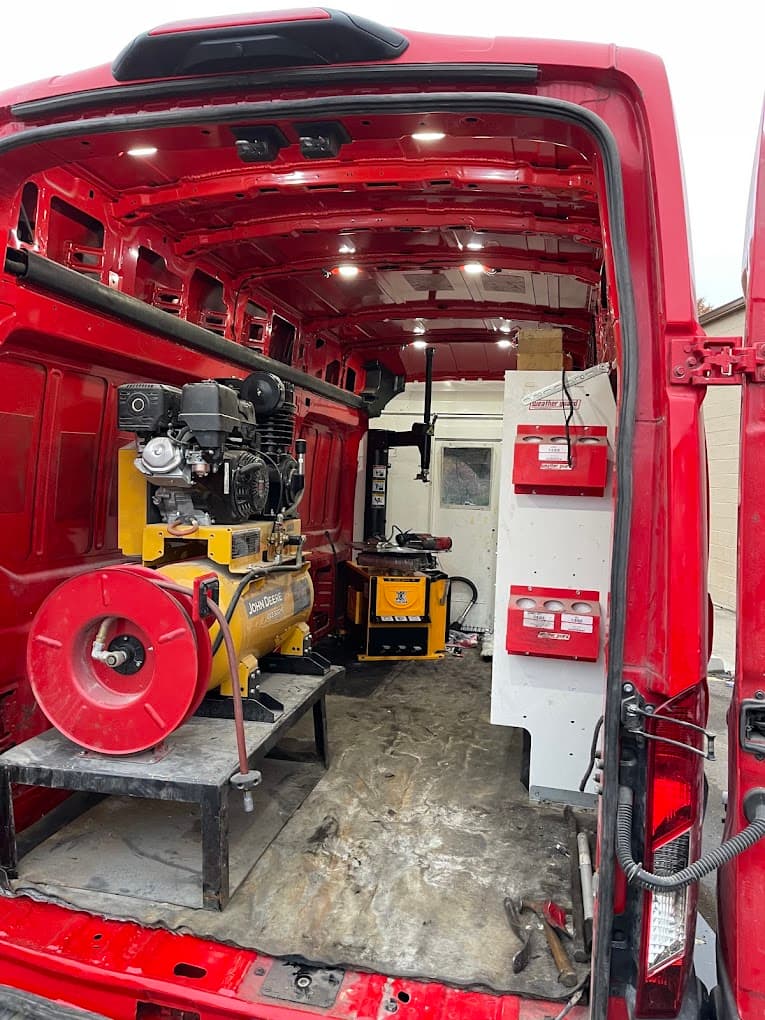Inside the Mobile Tire Boys service van — air compressor, tire changer, balancer, tools